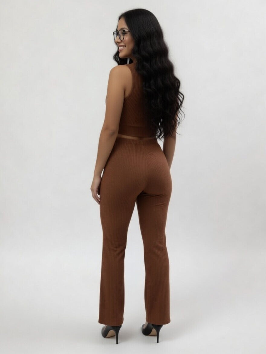 Woman wearing a brown jumpsuit on a white background