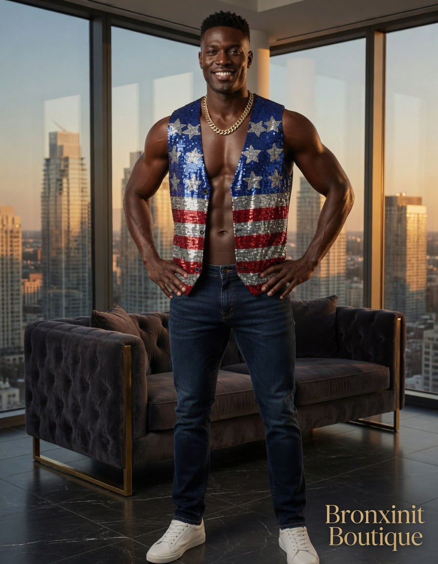 Man wearing a sleeveless shirt with an American flag design in a room with large windows showing a cityscape.