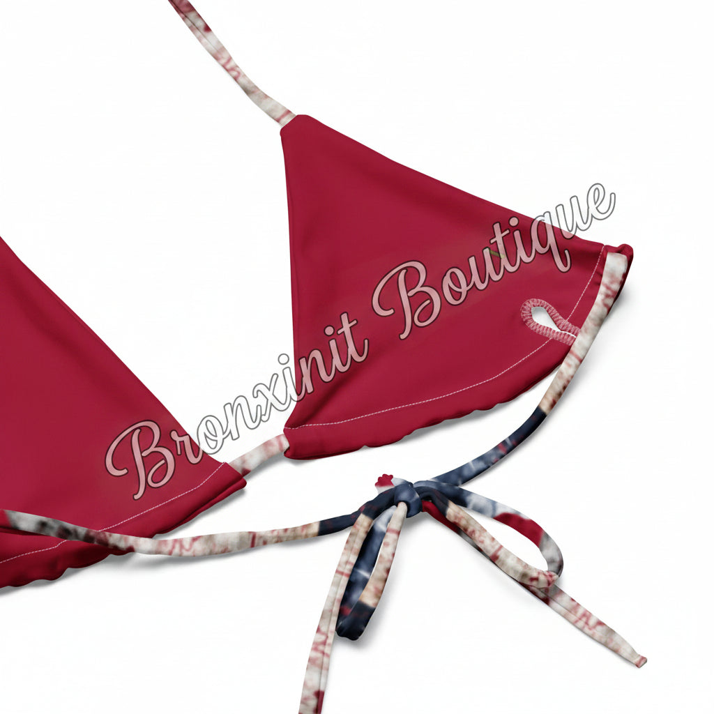 Red bikini top with floral straps on a white background