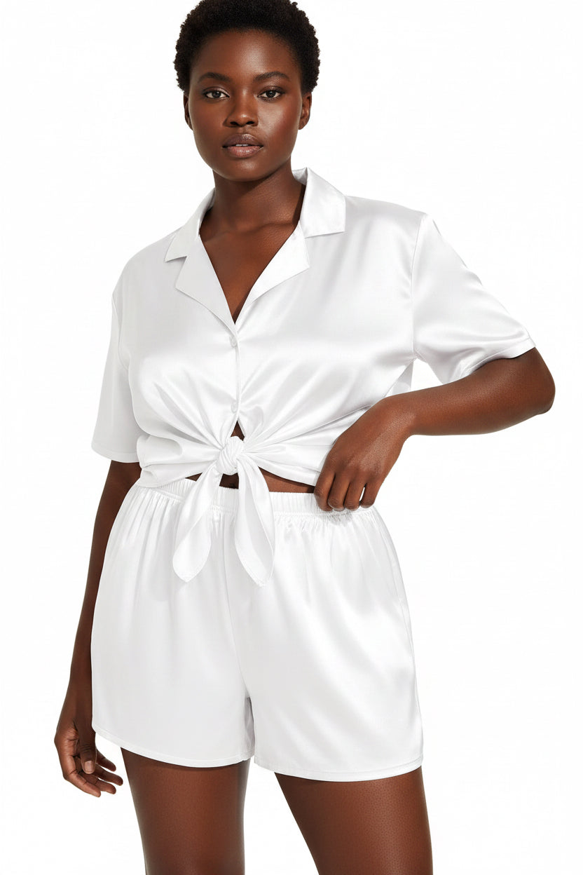 White shirt and shorts set worn by a model on a white background