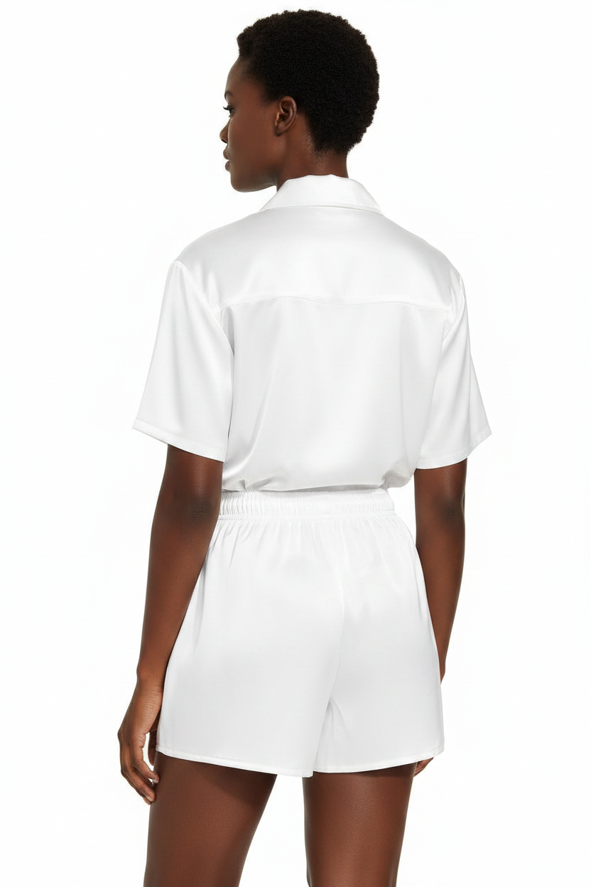 Person wearing a white outfit on a white background