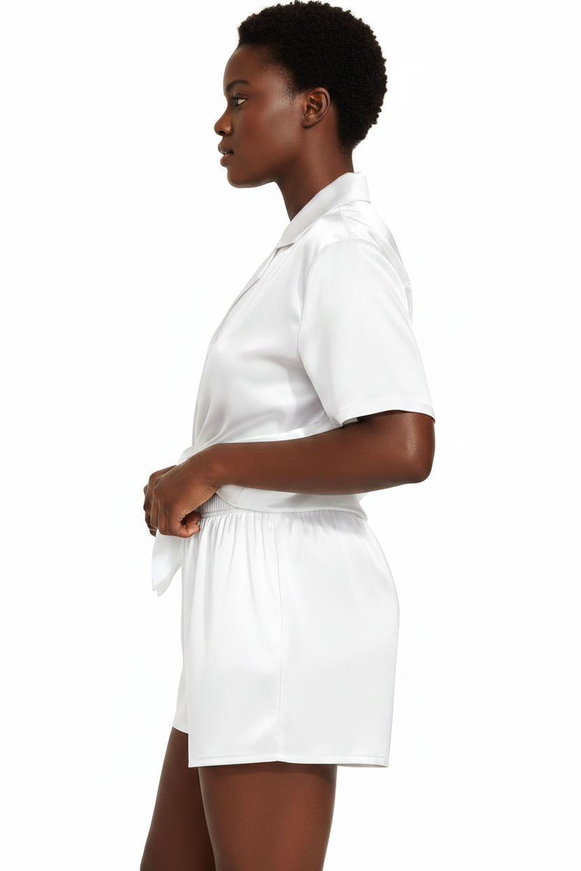 Person wearing a white outfit on a white background
