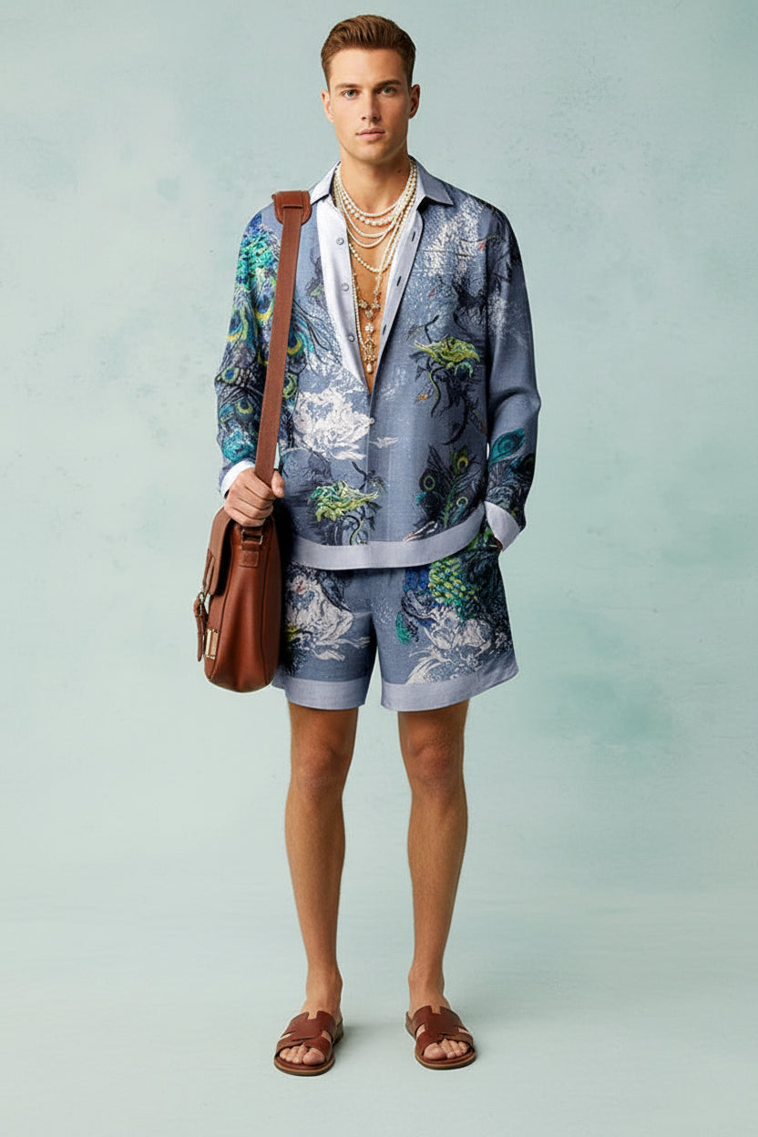 Person wearing a stylish outfit with a floral pattern on a light blue background