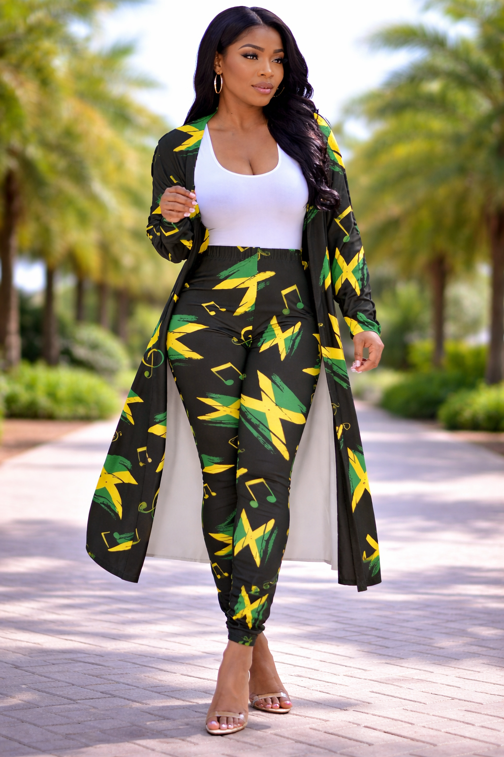 Woman wearing a Jamaican flag patterned outfit with a green and yellow color scheme.