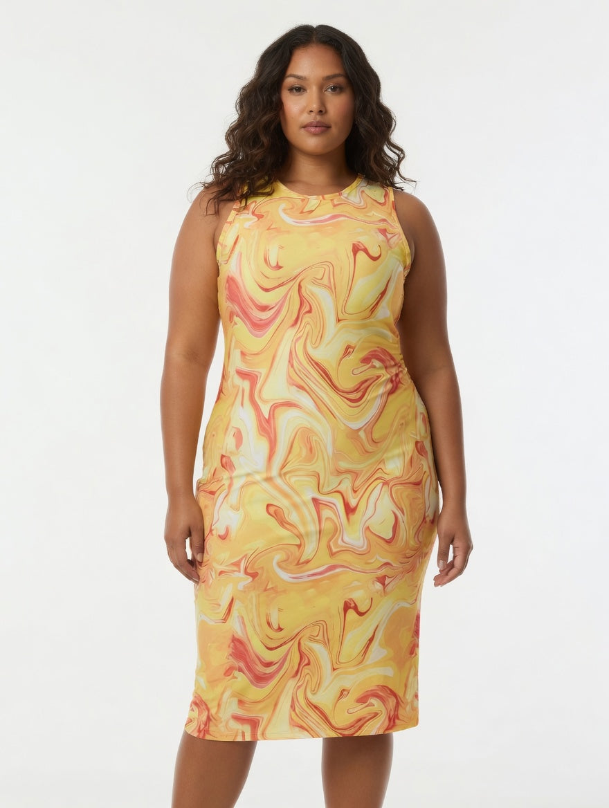 Woman wearing a yellow and pink marbled dress on a white background