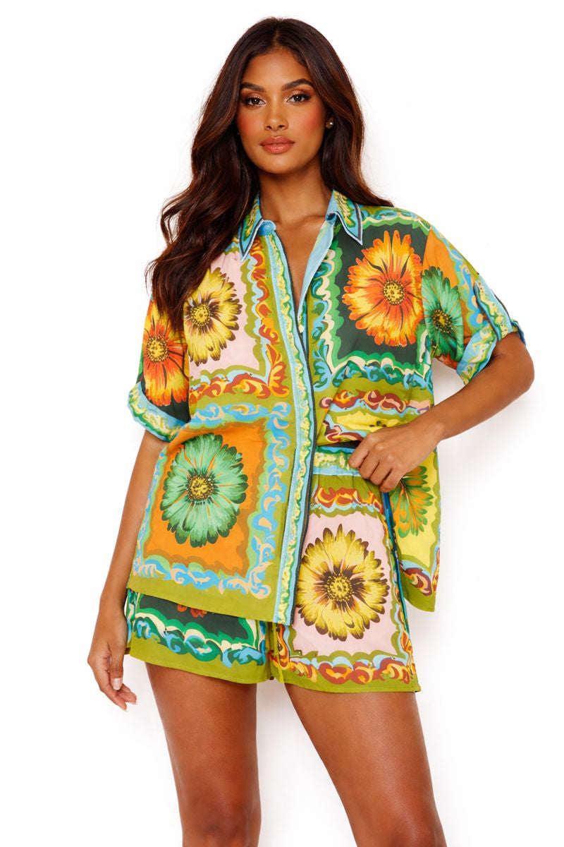 Luxury tropical floral linen short set on female model, button-up shirt and matching shorts, women’s summer resort wear on white background