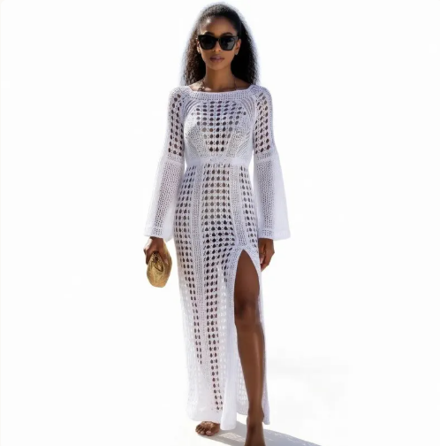 Woman wearing a white crochet dress on a white background