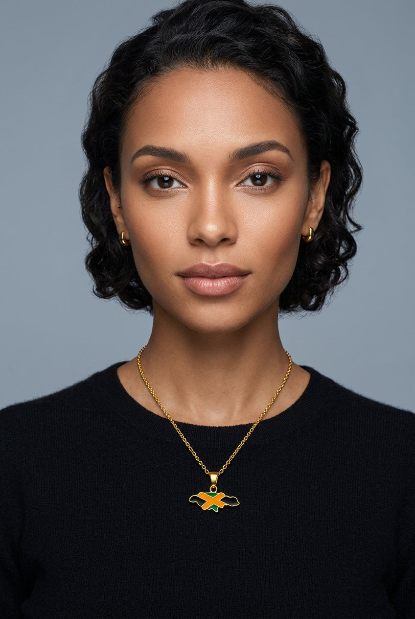 A golden necklace featuring a pendant with the Jamaican flag map design.